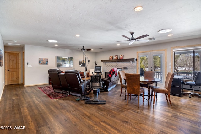 dining space with recessed lighting, wood finished floors, french doors, and a textured ceiling