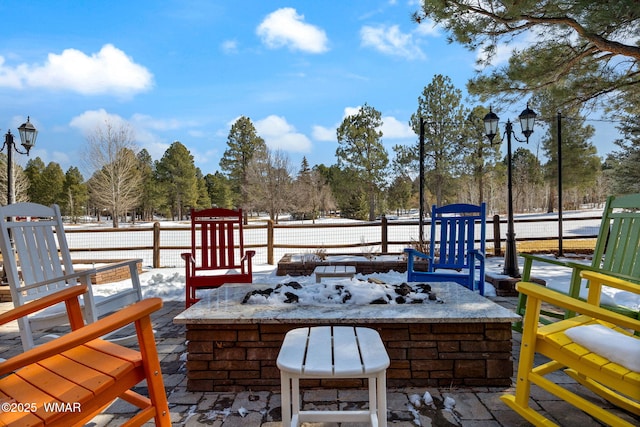 wooden deck featuring an outdoor fire pit