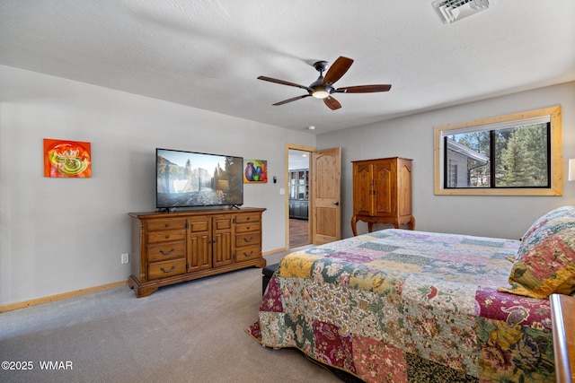 bedroom featuring visible vents, baseboards, ceiling fan, a textured ceiling, and light colored carpet