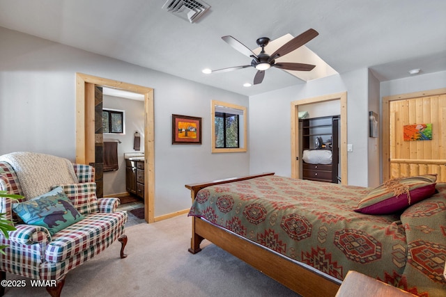 carpeted bedroom with visible vents, recessed lighting, connected bathroom, baseboards, and ceiling fan