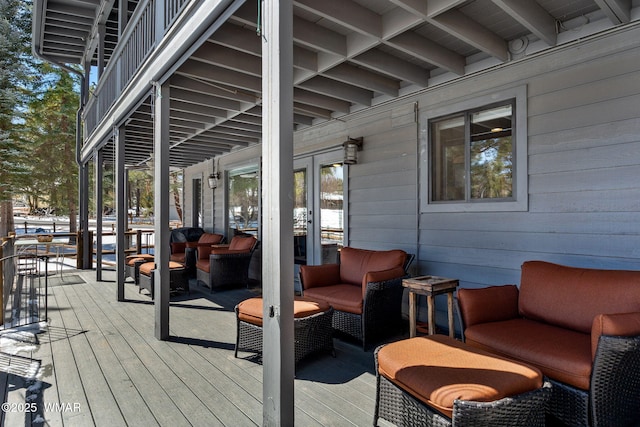 wooden terrace with outdoor lounge area