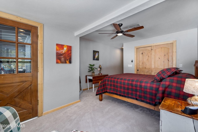 carpeted bedroom featuring a closet, visible vents, ceiling fan, and baseboards