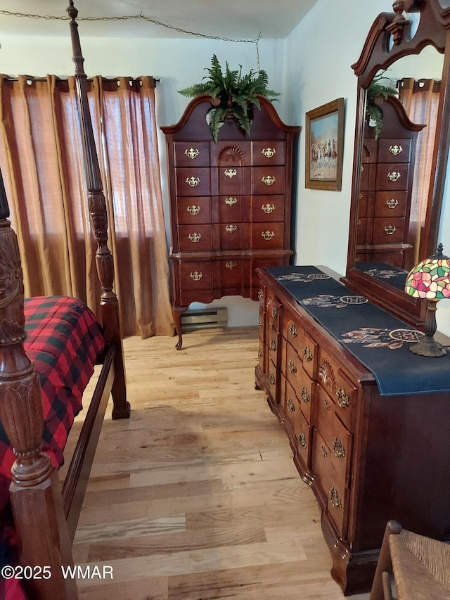 1949 Norton Pl, Show Low, AZ 85901 - bedroom with light wood-style flooring and a baseboard heating unit