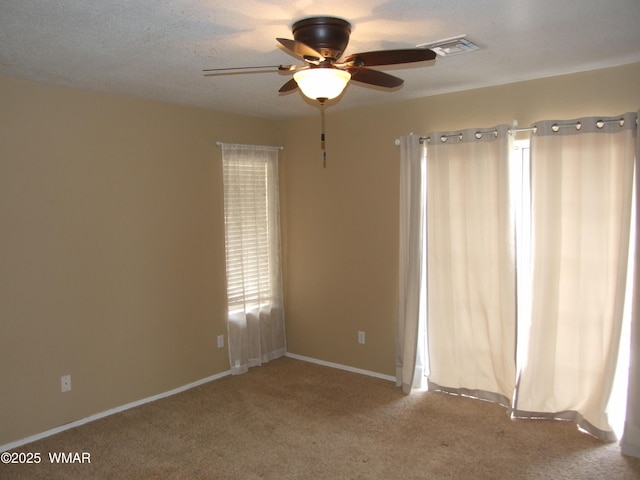 2124 W Vista Dr, Snowflake, AZ 85937 - empty room featuring carpet floors, ceiling fan, visible vents, and baseboards