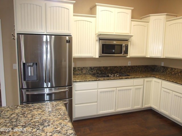 2124 W Vista Dr, Snowflake, AZ 85937 - kitchen with dark stone counters, dark wood finished floors, and appliances with stainless steel finishes