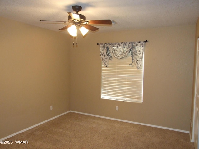 2124 W Vista Dr, Snowflake, AZ 85937 - unfurnished room featuring a ceiling fan, baseboards, and carpet