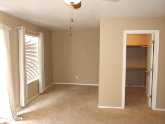 2124 W Vista Dr, Snowflake, AZ 85937 - unfurnished bedroom with carpet floors, baseboards, a spacious closet, and a closet