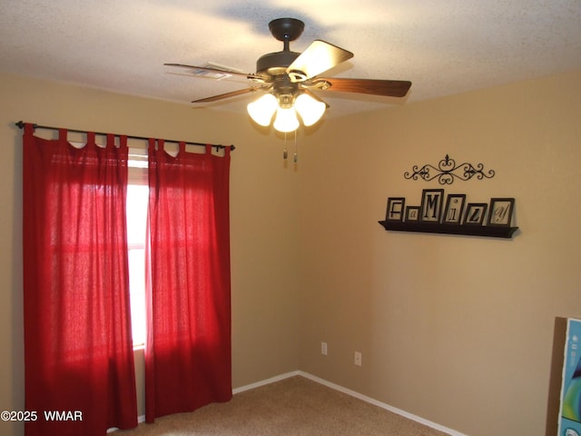 2124 W Vista Dr, Snowflake, AZ 85937 - carpeted spare room featuring baseboards and a ceiling fan