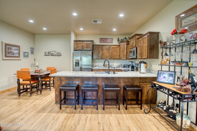 5863 Apollo Way, Lakeside, AZ 85929 - kitchen with appliances with stainless steel finishes, a sink, a peninsula, light wood finished floors, and recessed lighting