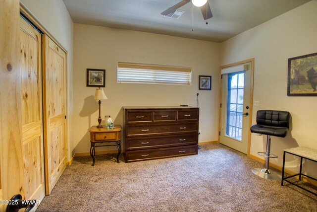 5863 Apollo Way, Lakeside, AZ 85929 - living area with light carpet, a ceiling fan, and baseboards