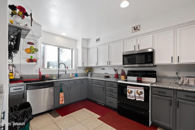 1275 Flag Hollow Rd, Lakeside, AZ 85929 - kitchen with appliances with stainless steel finishes, gray cabinets, a sink, light tile patterned flooring, and white cabinetry
