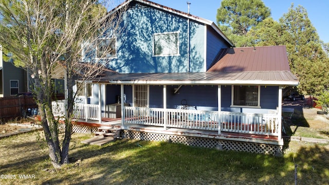 1275 Flag Hollow Rd, Lakeside, AZ 85929 - view of front of house with a front lawn, metal roof, and covered porch