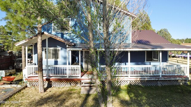 1275 Flag Hollow Rd, Lakeside, AZ 85929 - rear view of property with metal roof and a yard