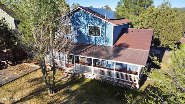 1275 Flag Hollow Rd, Lakeside, AZ 85929 - back of house featuring metal roof, roof mounted solar panels, and a porch