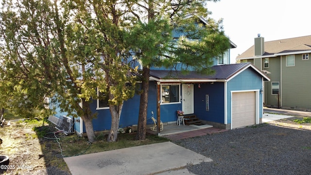 1275 Flag Hollow Rd, Lakeside, AZ 85929 - ranch-style home featuring a garage, metal roof, and driveway