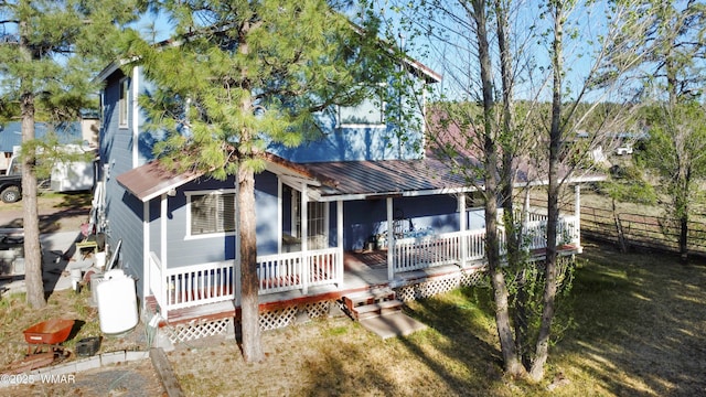 1275 Flag Hollow Rd, Lakeside, AZ 85929 - view of front of property with fence, metal roof, and a porch
