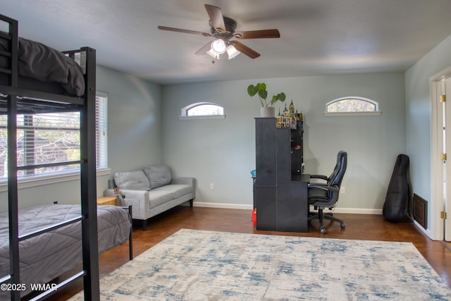 1421 N 36th Dr, Show Low, AZ 85901 - bedroom featuring a desk, baseboards, wood finished floors, and a ceiling fan
