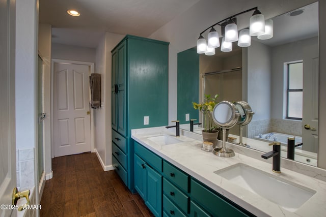 1421 N 36th Dr, Show Low, AZ 85901 - full bathroom with double vanity, a bath, wood finished floors, a shower stall, and recessed lighting