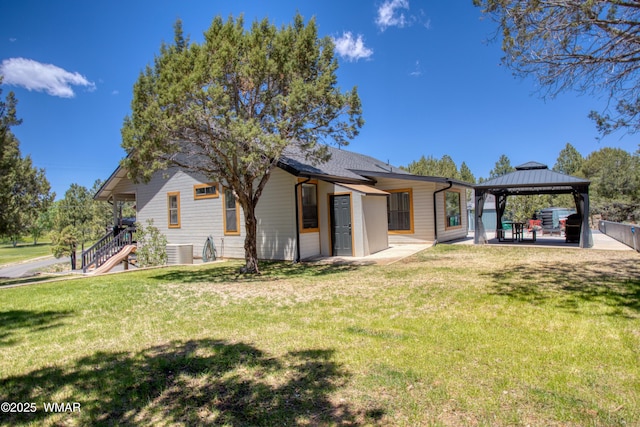 1421 N 36th Dr, Show Low, AZ 85901 - back of property featuring a gazebo, central AC unit, a yard, and a patio