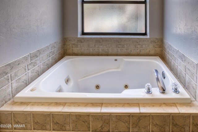 1421 N 36th Dr, Show Low, AZ 85901 - full bathroom featuring a whirlpool tub and a textured wall