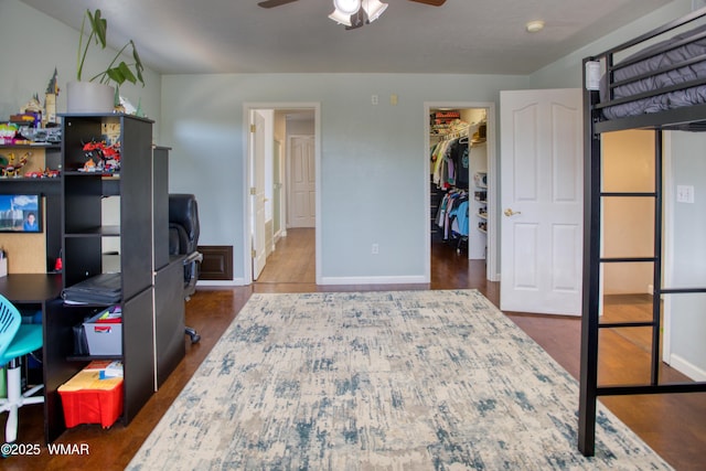 1421 N 36th Dr, Show Low, AZ 85901 - bedroom featuring a spacious closet, baseboards, a desk, wood finished floors, and a closet