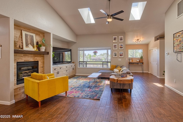 1421 N 36th Dr, Show Low, AZ 85901 - living room featuring a skylight, lofted ceiling, wood finished floors, and baseboards