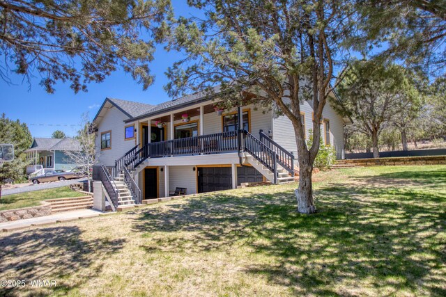 1421 N 36th Dr, Show Low, AZ 85901 - rear view of property featuring stairway, ceiling fan, a lawn, covered porch, and an attached garage
