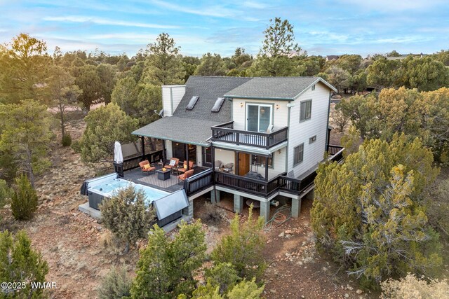 1513 Low Mountain Trl, Heber, AZ 85928 - back of house with an outdoor hangout area, a deck, a wooded view, and roof with shingles