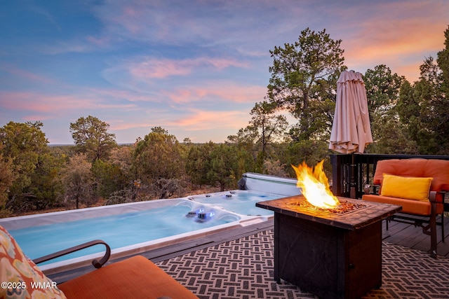1513 Low Mountain Trl, Heber, AZ 85928 - pool at dusk with an outdoor fire pit and a hot tub