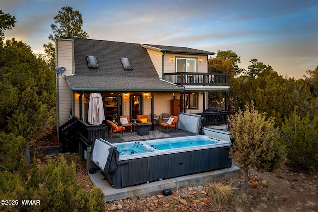 1513 Low Mountain Trl, Heber, AZ 85928 - back of house featuring a balcony, a chimney, a shingled roof, and a hot tub