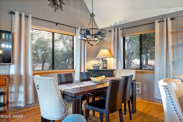 1513 Low Mountain Trl, Heber, AZ 85928 - dining room with visible vents, vaulted ceiling, light wood-style flooring, and an inviting chandelier