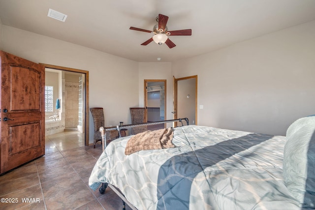 bedroom featuring ensuite bath and a ceiling fan