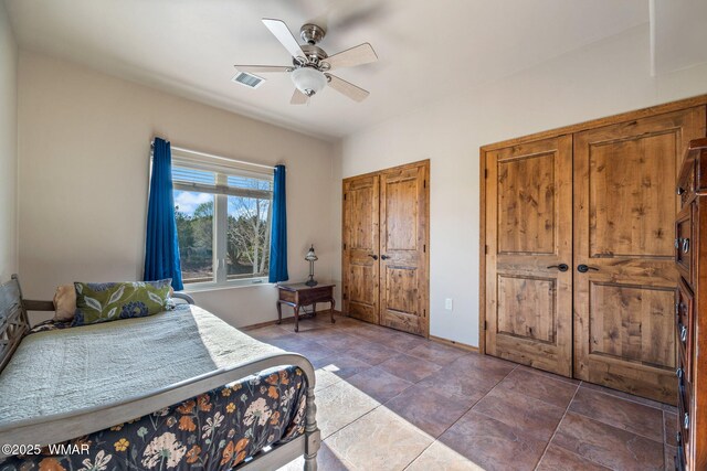 bedroom with baseboards and a ceiling fan