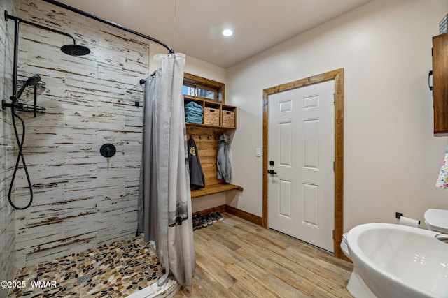 2737 Skyhawk Dr, Overgaard, AZ 85933 - bathroom featuring recessed lighting, tiled shower, wood finished floors, and baseboards