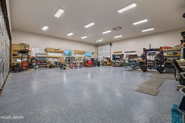 2737 Skyhawk Dr, Overgaard, AZ 85933 - garage with a workshop area