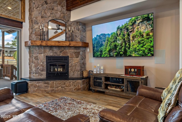 2737 Skyhawk Dr, Overgaard, AZ 85933 - living area featuring beam ceiling, wood finished floors, and a fireplace
