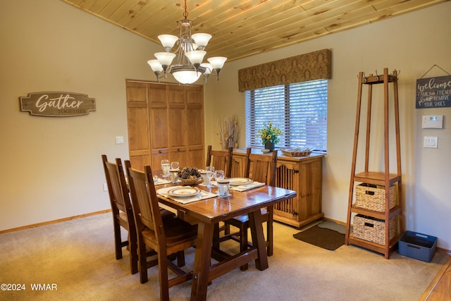 dining room with baseboards, wooden ceiling, an inviting chandelier, and light colored carpet