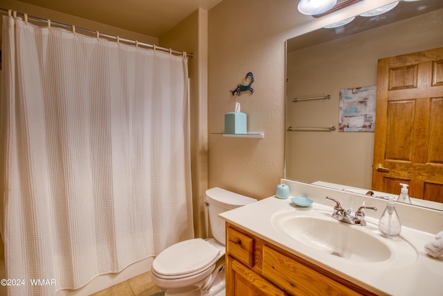 full bath featuring a textured wall, tile patterned flooring, vanity, and toilet