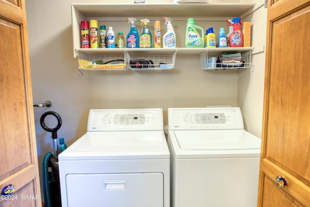 clothes washing area featuring laundry area and washer and dryer