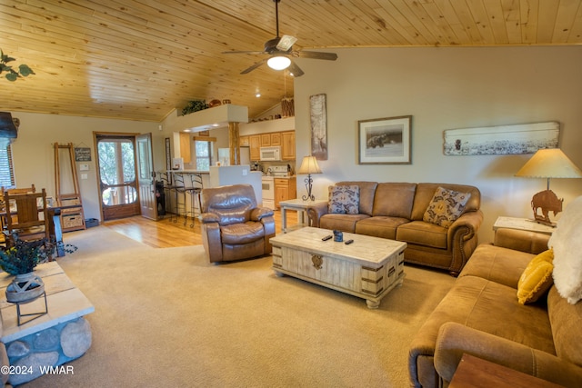 living room featuring high vaulted ceiling, a ceiling fan, wood ceiling, and light colored carpet