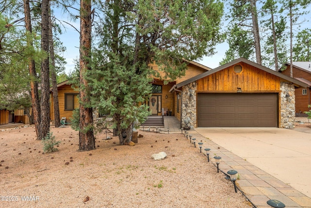 4602 Mountain Gate Cir, Lakeside, AZ 85929 - view of front of property featuring a garage, stone siding, and driveway