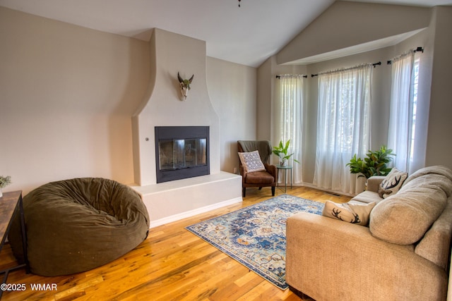 4701 S Manzanita Way, Show Low, AZ 85901 - living area with vaulted ceiling, wood finished floors, and a large fireplace