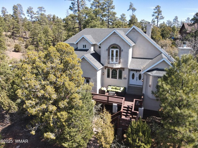 4701 S Manzanita Way, Show Low, AZ 85901 - rear view of house featuring a chimney, french doors, roof with shingles, an outdoor living space, and stucco siding