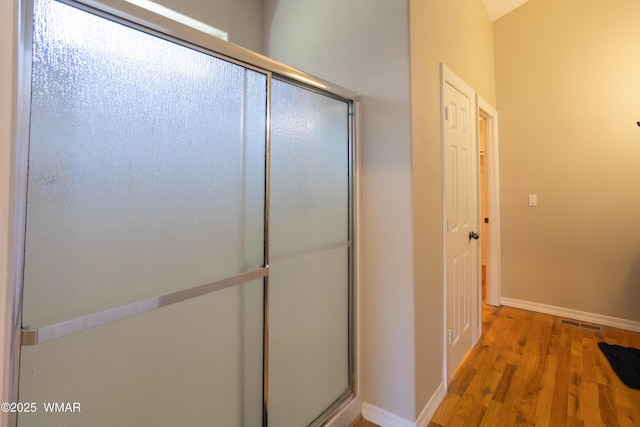 4701 S Manzanita Way, Show Low, AZ 85901 - full bath with baseboards, wood finished floors, and a shower with door