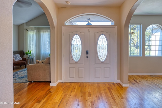 4701 S Manzanita Way, Show Low, AZ 85901 - entryway with light wood-type flooring, arched walkways, and baseboards