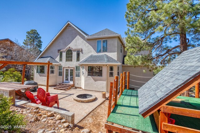 4701 S Manzanita Way, Show Low, AZ 85901 - back of property with stucco siding, an outdoor fire pit, a patio, and french doors