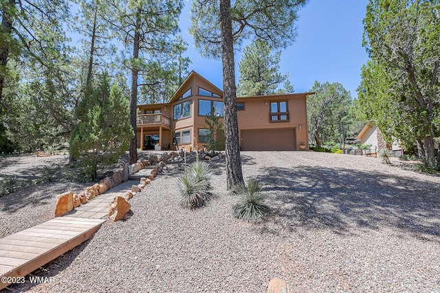 view of front of home with a garage and driveway