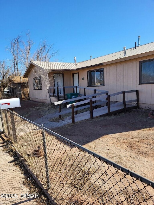 view of front of house with fence