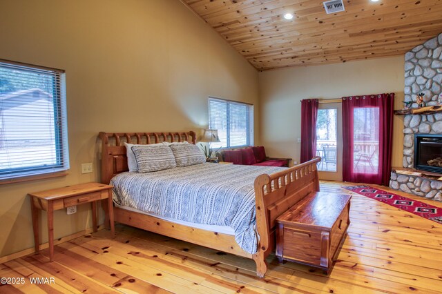 5238 Buck Springs Rd, Pinetop, AZ 85935 - bedroom featuring hardwood / wood-style flooring, high vaulted ceiling, a stone fireplace, wood ceiling, and recessed lighting