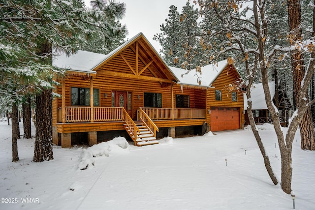 5238 Buck Springs Rd, Pinetop, AZ 85935 - view of front of property featuring a garage, log veneer siding, and covered porch